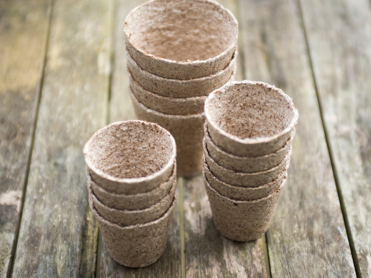 Nutley's Kitchen Gardens Coco Fibre Pots Stacked On A Wooden Table Top